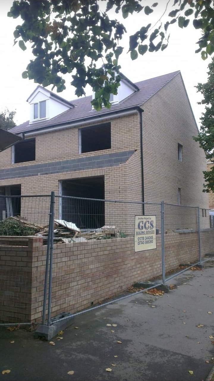 Sharp gable end with corbelled brick verge