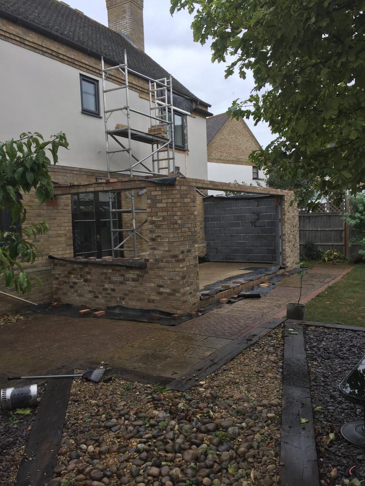 Scaffold tower against rendered house